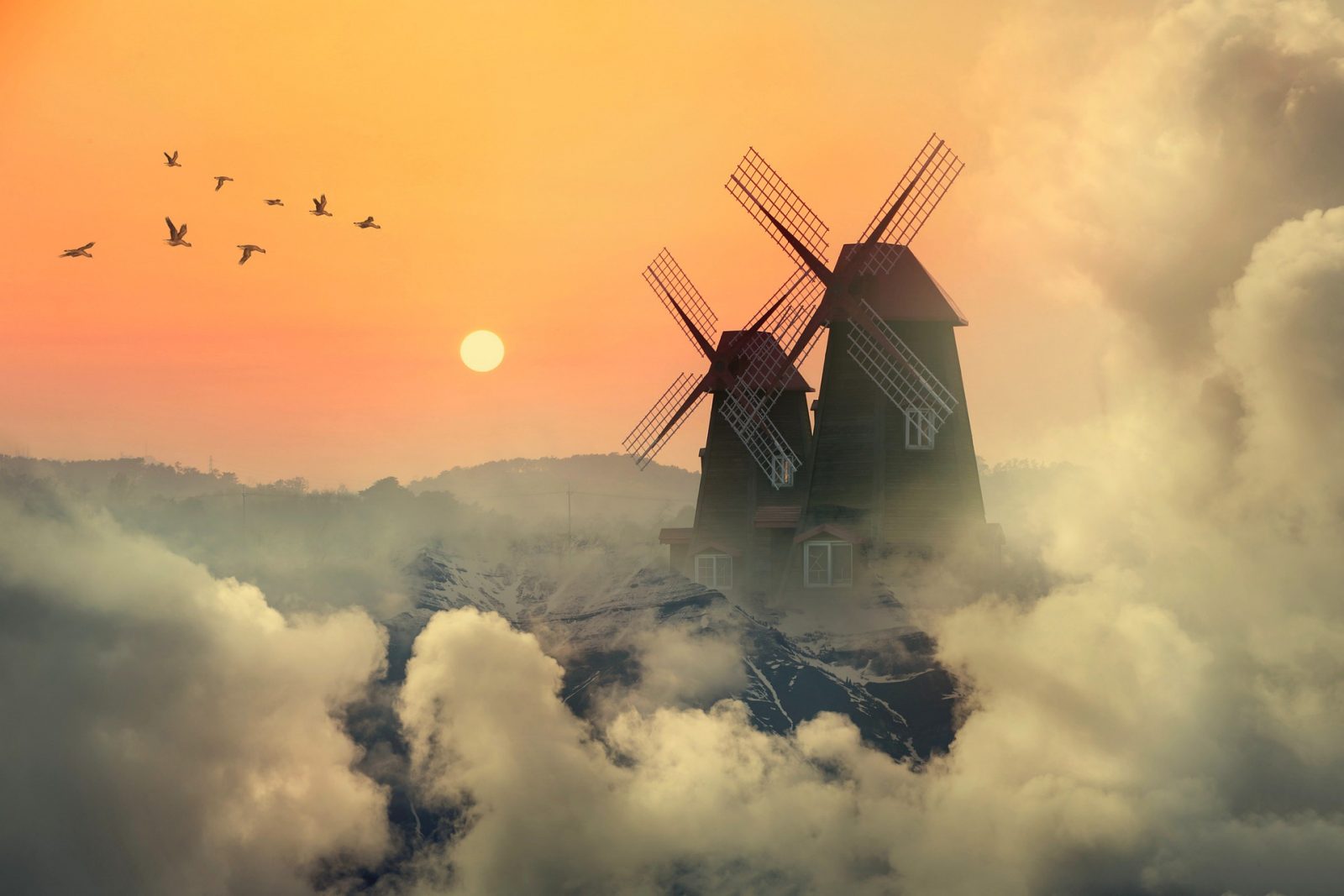 dva veterné mlyny v západe slnka